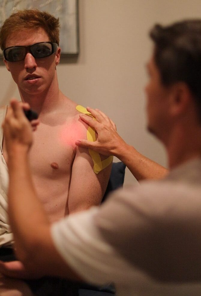 High-intensity laser therapy treatment session at Acadiana Pain & Performance Rehab